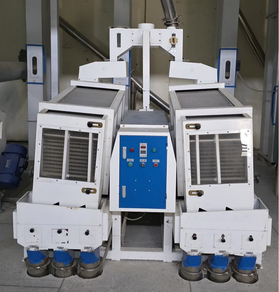 Paddy separator equipment inside the rice processing facility.