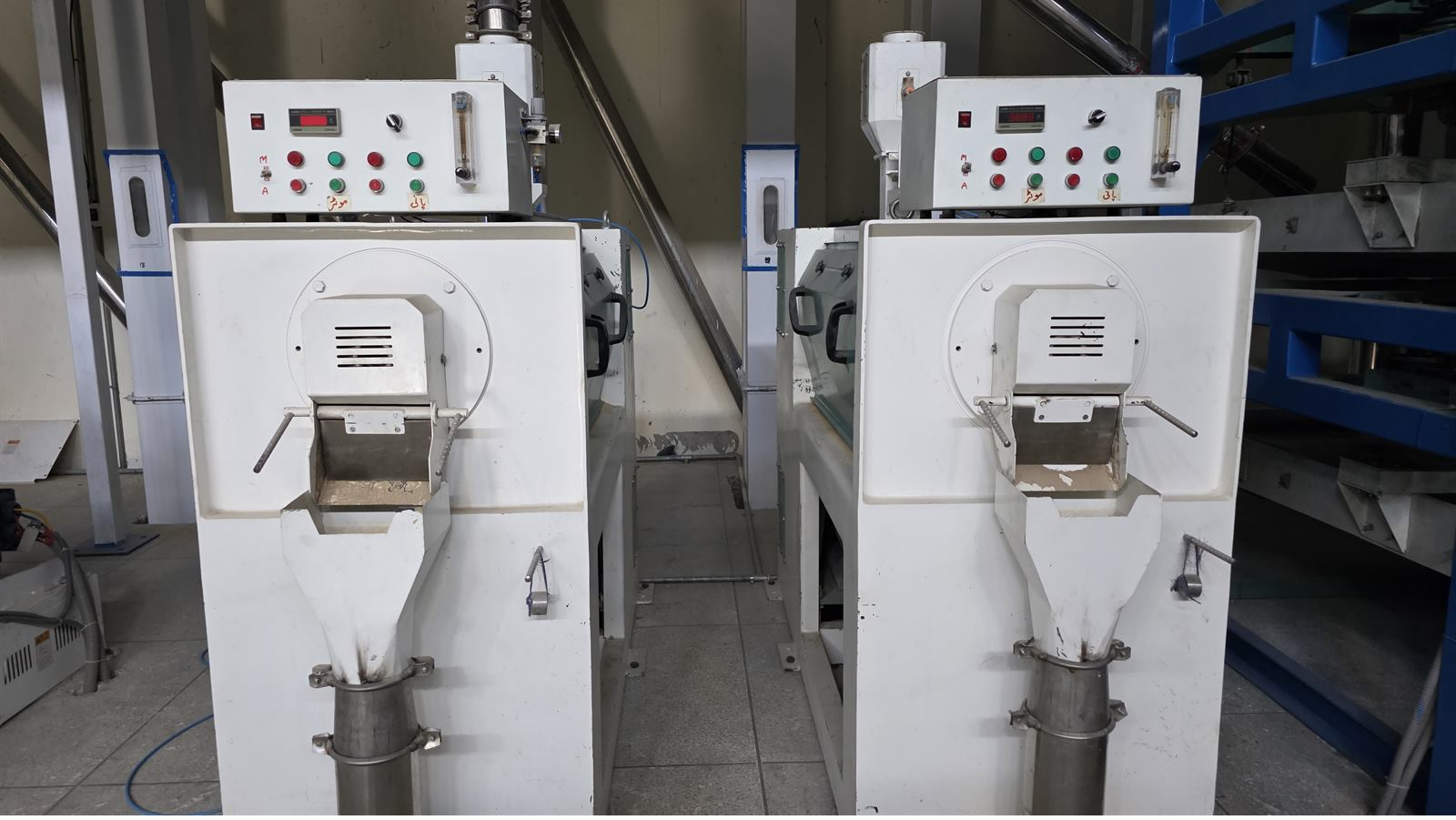 Rice polishing equipment inside the processing facility.
